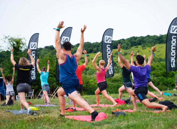 trail runners stretching out at a Salomon camp